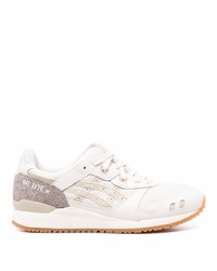 Chaussures de sport en cuir blanches Asics