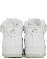 Chaussures de sport en cuir blanches Nike