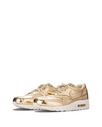 Chaussures de sport en cuir dorées Nike