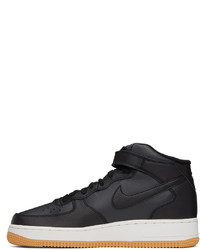 Chaussures de sport en cuir noires Nike