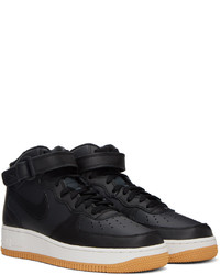 Chaussures de sport en cuir noires Nike