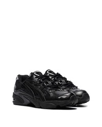 Chaussures de sport en cuir noires Asics