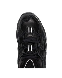 Chaussures de sport en cuir noires Asics