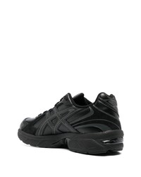 Chaussures de sport en cuir noires Asics