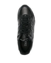 Chaussures de sport en cuir noires Asics