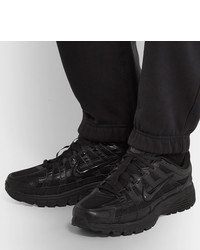 Chaussures de sport en cuir noires Nike