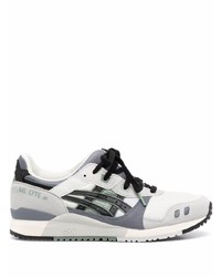 Chaussures de sport grises Asics