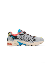 Chaussures de sport grises Asics