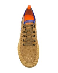 Chaussures de sport imprimées dorées Nike