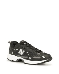 Chaussures de sport noires et blanches New Balance