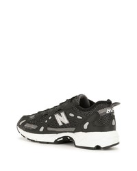 Chaussures de sport noires et blanches New Balance