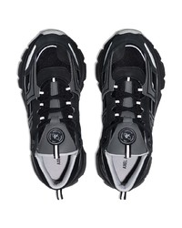 Chaussures de sport noires et blanches Axel Arigato