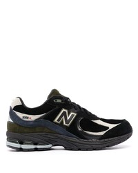 Chaussures de sport noires et blanches New Balance