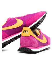 Chaussures de sport pourpres Nike