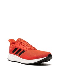 Chaussures de sport rouge et blanc adidas