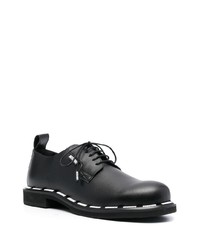 Chaussures derby en cuir imprimées noires Moschino