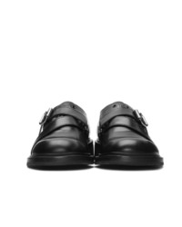 Chaussures derby en cuir noires Prada