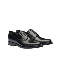 Chaussures derby en cuir noires Prada