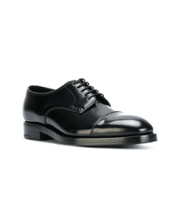 Chaussures derby en cuir noires Prada