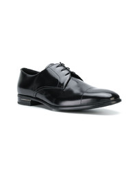 Chaussures derby en cuir noires Prada