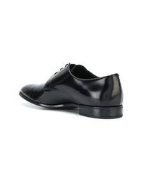 Chaussures derby en cuir noires Prada