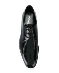 Chaussures derby en cuir noires Prada