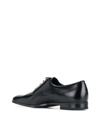 Chaussures derby en cuir noires Prada