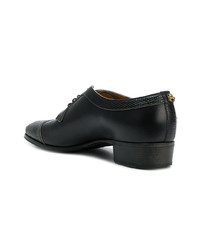 Chaussures derby en cuir noires Gucci