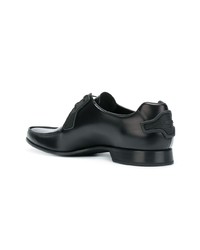 Chaussures derby en cuir noires Prada