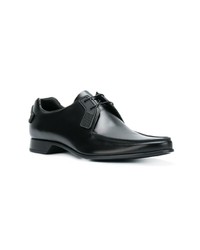 Chaussures derby en cuir noires Prada