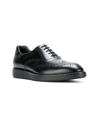 Chaussures derby en cuir noires Prada