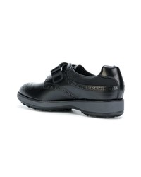 Chaussures derby en cuir noires Prada