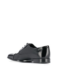 Chaussures derby en cuir noires Prada