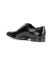 Chaussures derby en cuir noires Prada