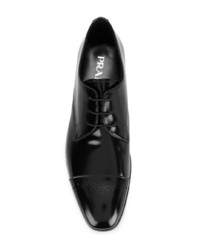 Chaussures derby en cuir noires Prada