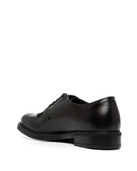 Chaussures derby en cuir noires Prada