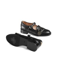 Chaussures plates en cuir à clous noires Gucci