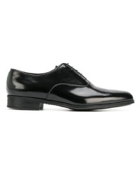 Chaussures richelieu en cuir noires Prada