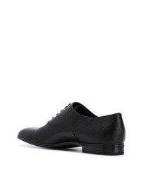 Chaussures richelieu en cuir noires Prada