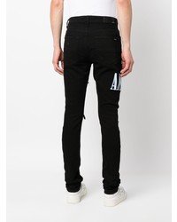 Jean imprimé tie-dye noir Amiri