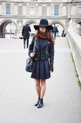 Comment porter un sac bourse en cuir noir