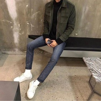 Une veste harrington à porter avec un jean bleu