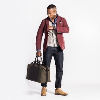 Un gilet à porter avec un jean gris foncé