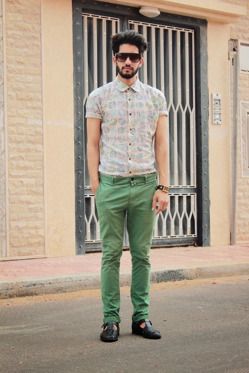 green chinos with black shirt