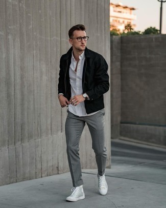 Une veste harrington à porter avec un pantalon chino gris