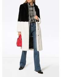 Manteau de fourrure noir et blanc Stand