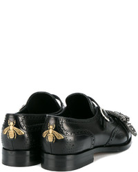 Monks en cuir noirs Gucci