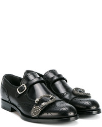 Monks en cuir noirs Gucci