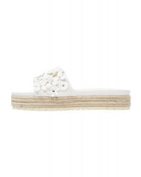 Mules en cuir blanches Buffalo