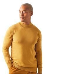 Pull à col roulé doré